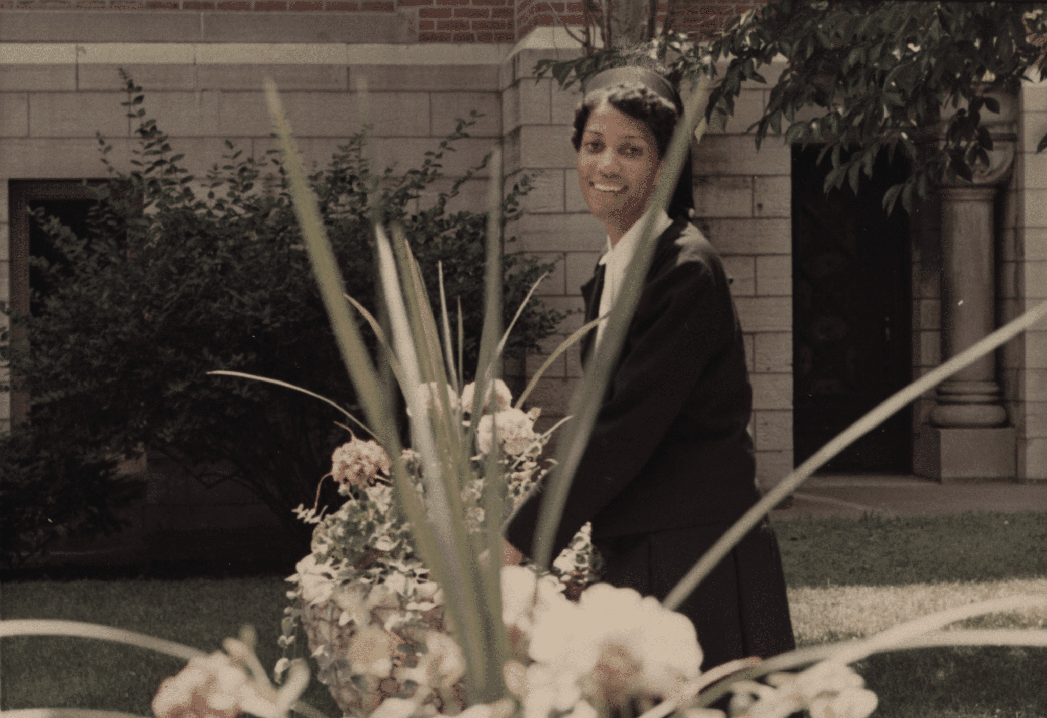 Thea Bowman smiling near flowers