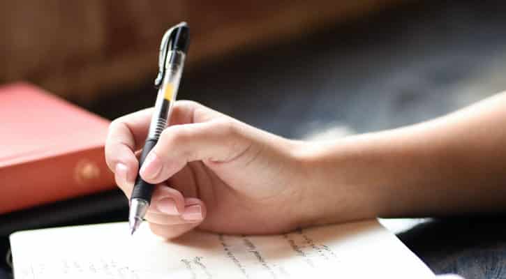 Woman writing in journal