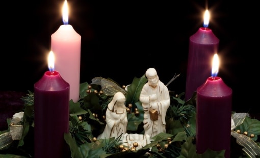 Nativity scene surrounded by candles