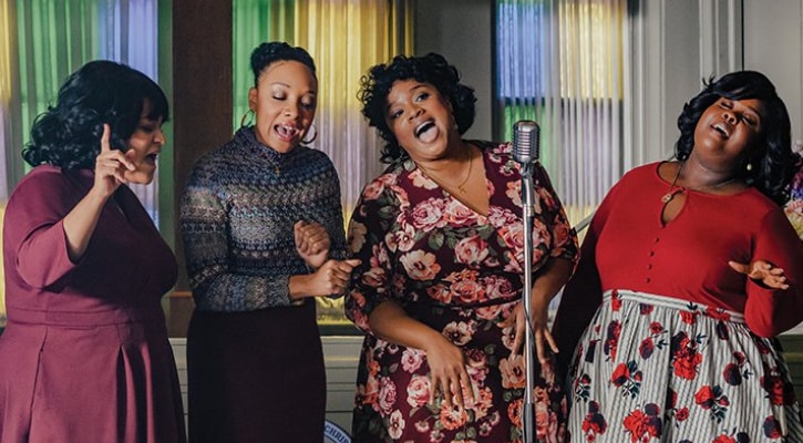 Four women singing
