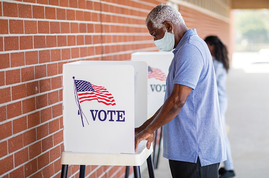 Person voting at a voting booth