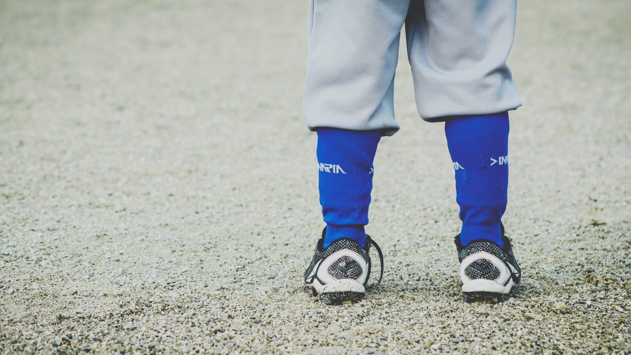 Baseball player legs from the back