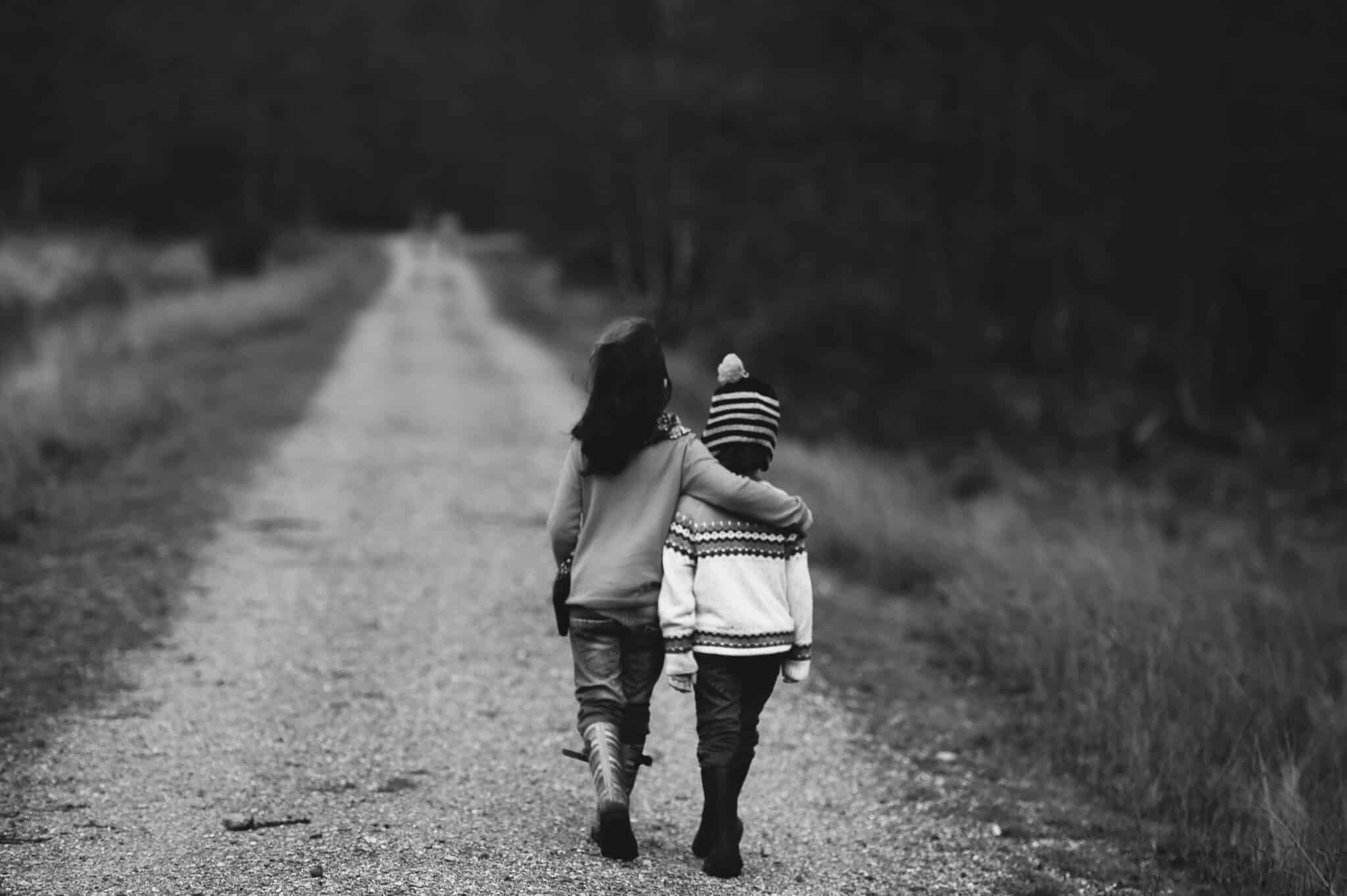 brother and sister walking | Photo by Annie Spratt on Unsplash