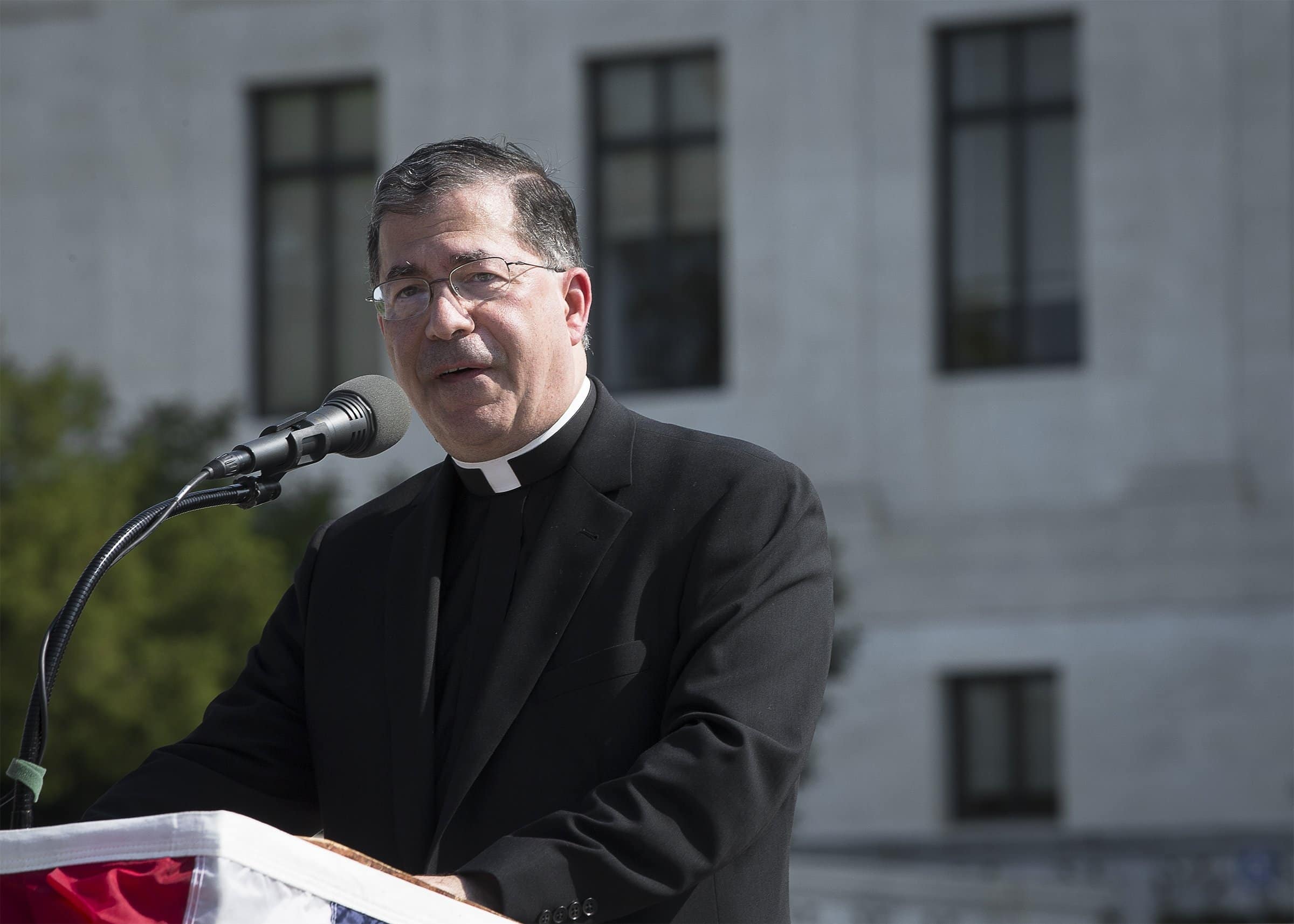 Father Frank Pavone, national director of Priests for Life, speaks in front of the U.S. Supreme Court in Washington Oct. 1, 2019. A Dec. 17, 2022, news report said Pavone had been dismissed from the clerical state for "blasphemous communications on social media" and "persistent disobedience of the lawful instructions of his diocesan bishop." (CNS photo/Tyler Orsburn)