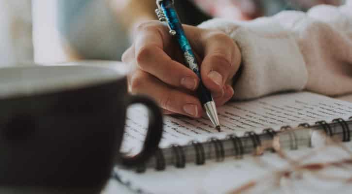 Hand writing in journal