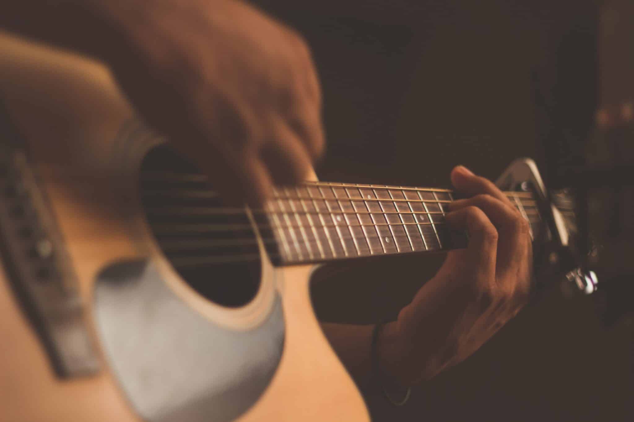 Person playing a guitar