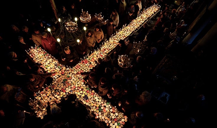 Lights form a cross on a Lenten table