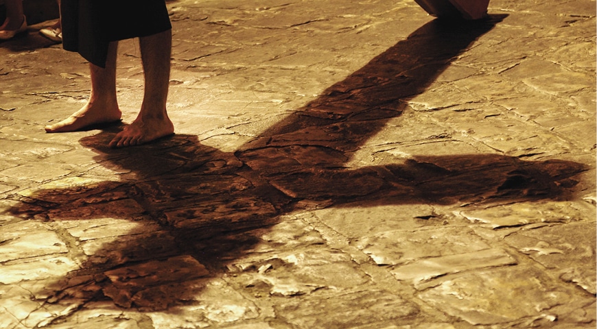 Shadow of Jesus carrying The Cross