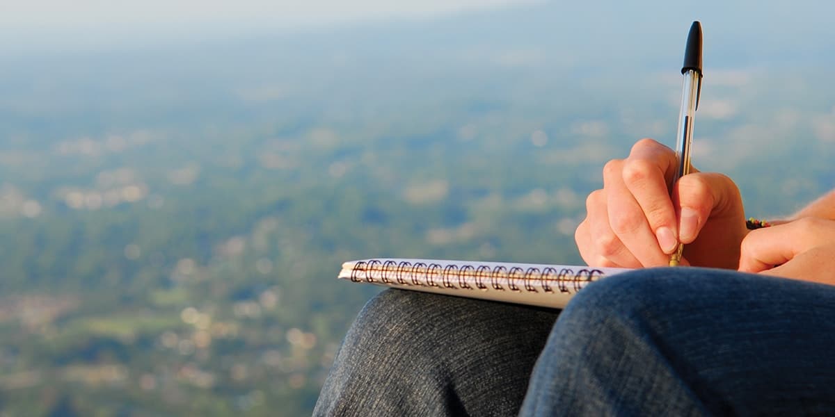 Woman writing in a journal