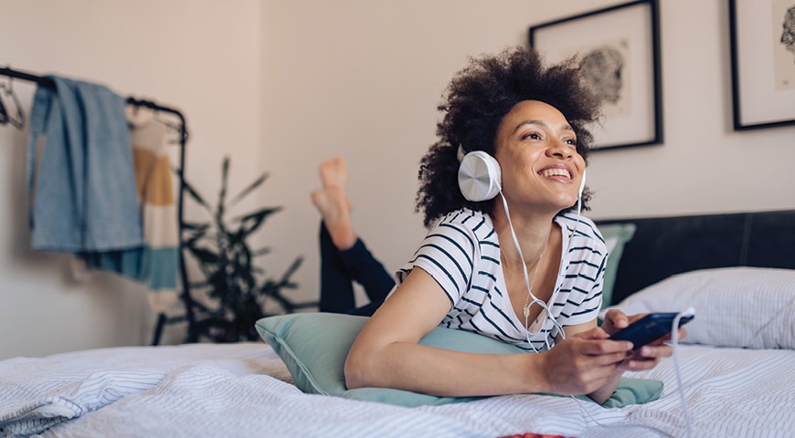 Young woman listening to a podcast