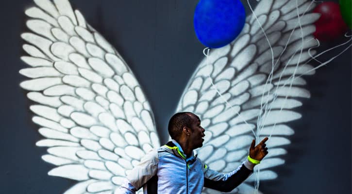 Man holding balloons