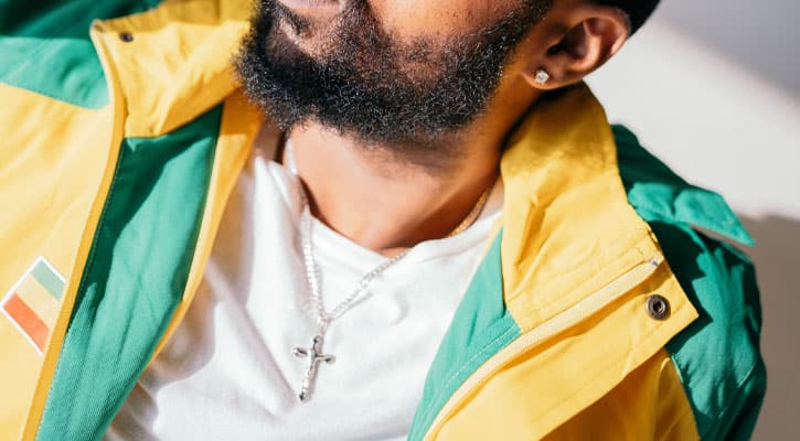 Bearded man with cross necklace