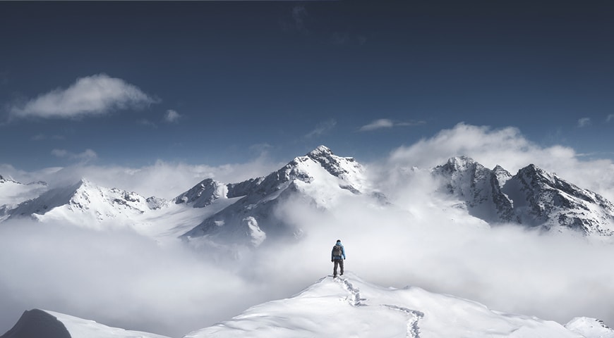 Man stands on a snowy mountain