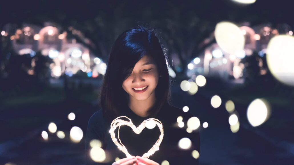 Woman holds a heart | Photo by Bart LaRue on Unsplash