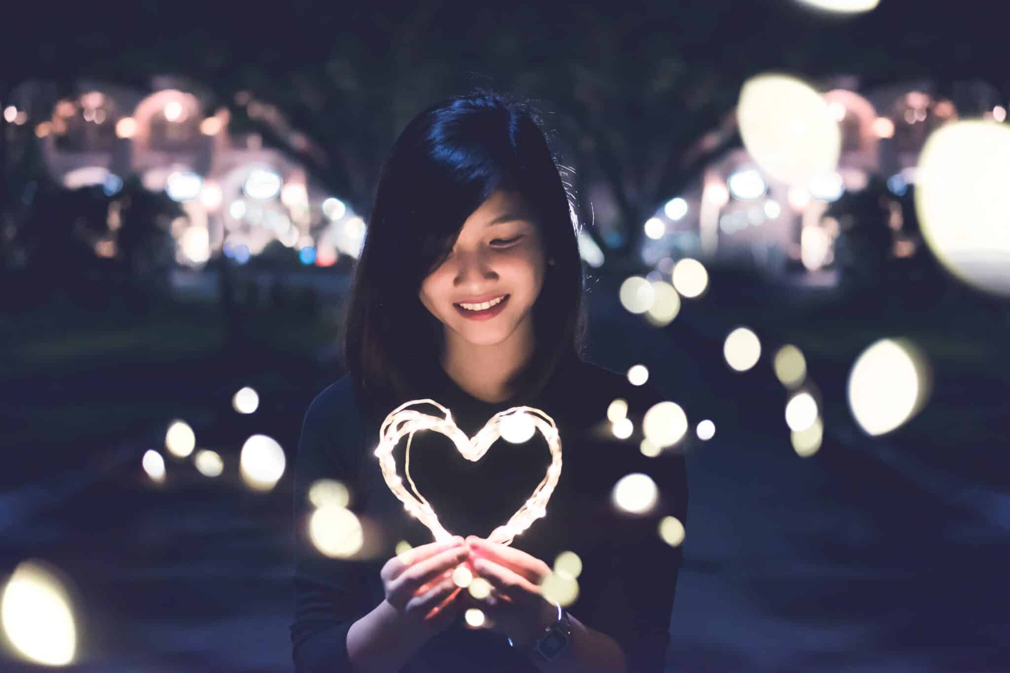 Woman holds a heart | Photo by Bart LaRue on Unsplash