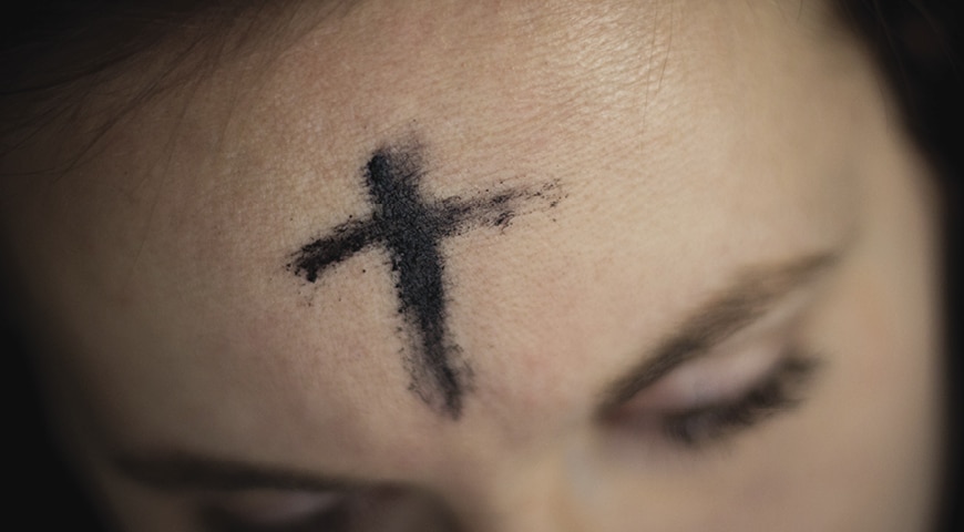Ashes on a woman's forehead
