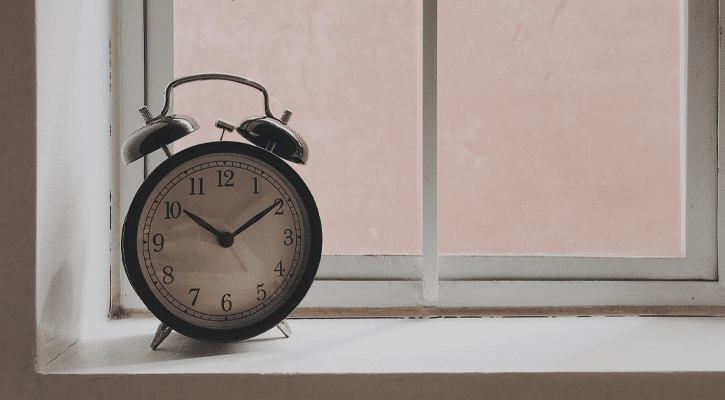 alarm clock on a windowsill