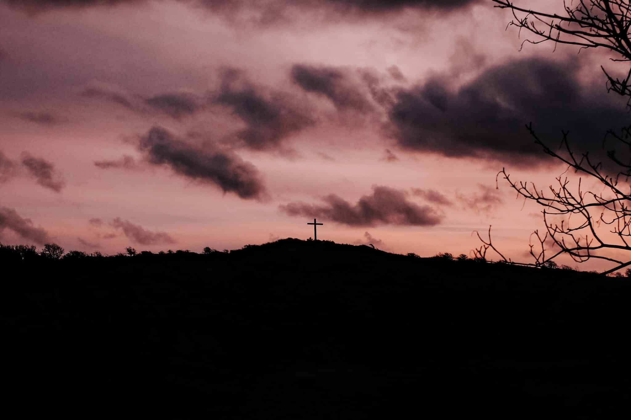 Cross on a mountainside | Photo by Teddy Jansen on Unsplash
