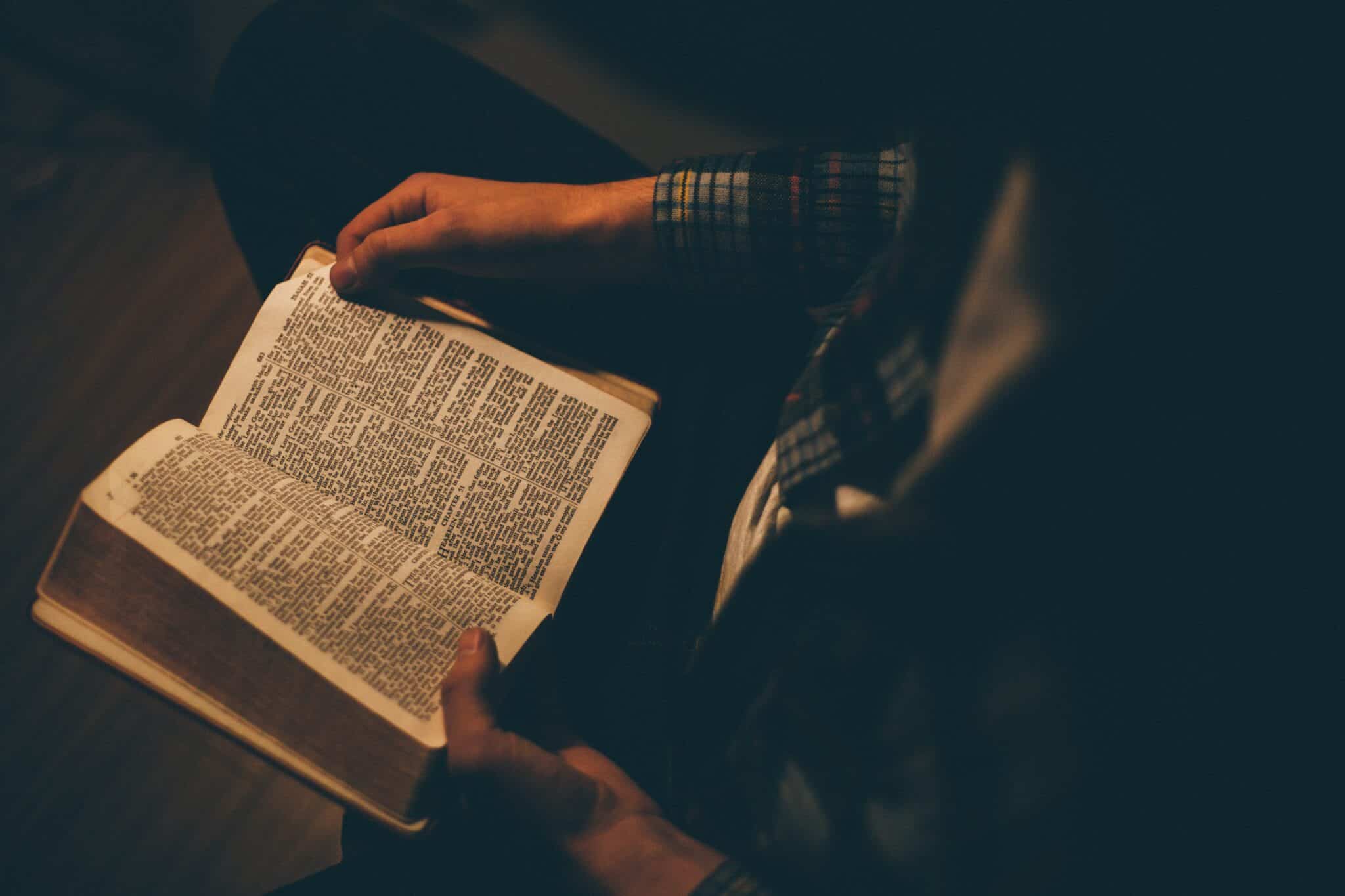 Man reading a bible | Photo by Priscilla Du Preez on Unsplash