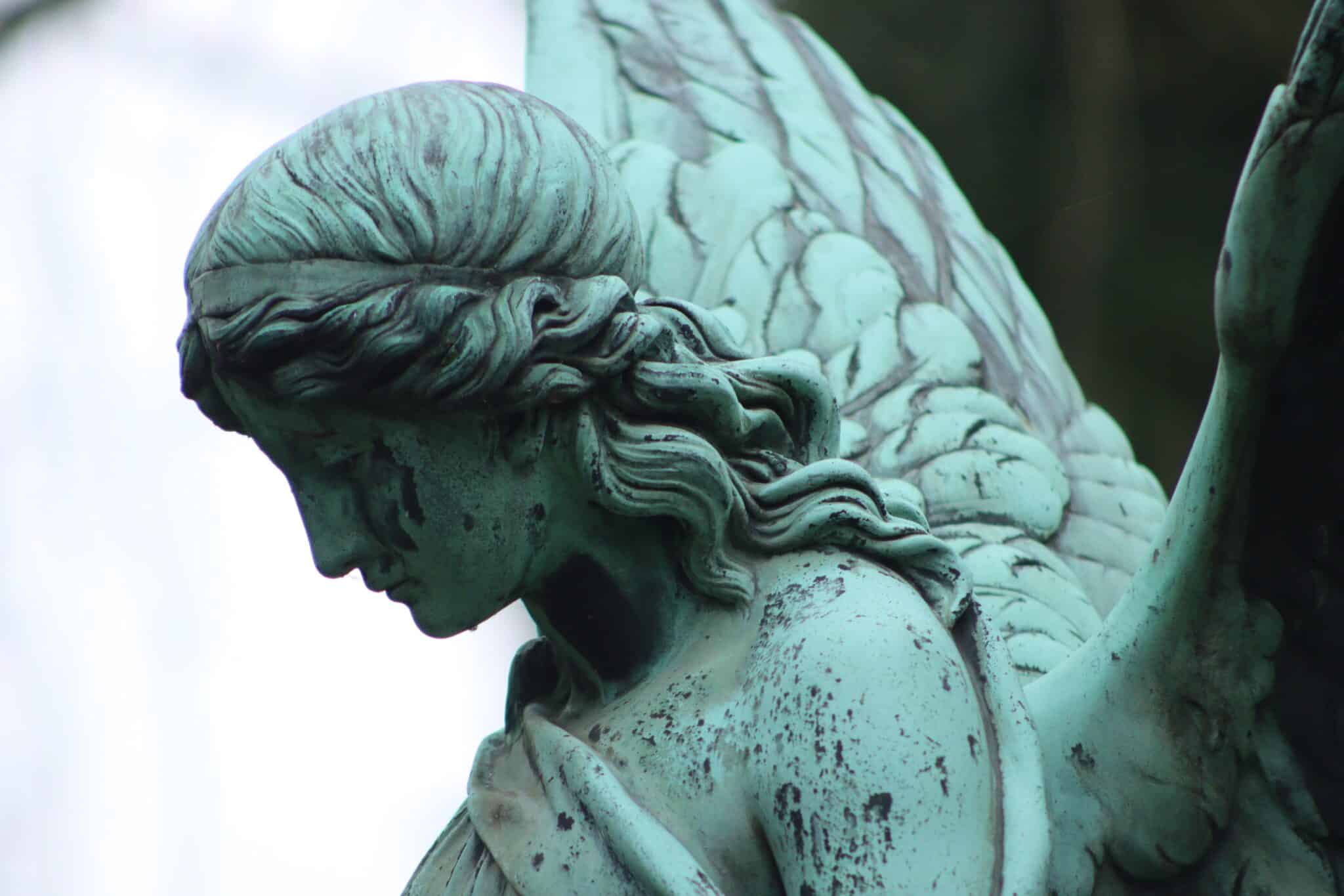 Angel in a cemetery. Via Unsplash