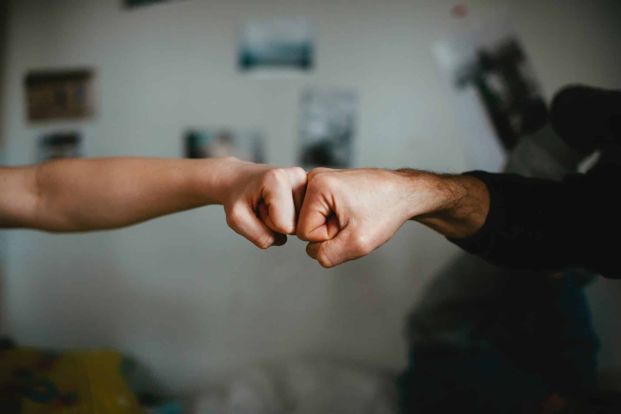 fist bumping | Photo by Markus Spiske on Unsplash