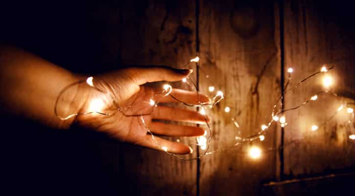 Hands with fairy lights