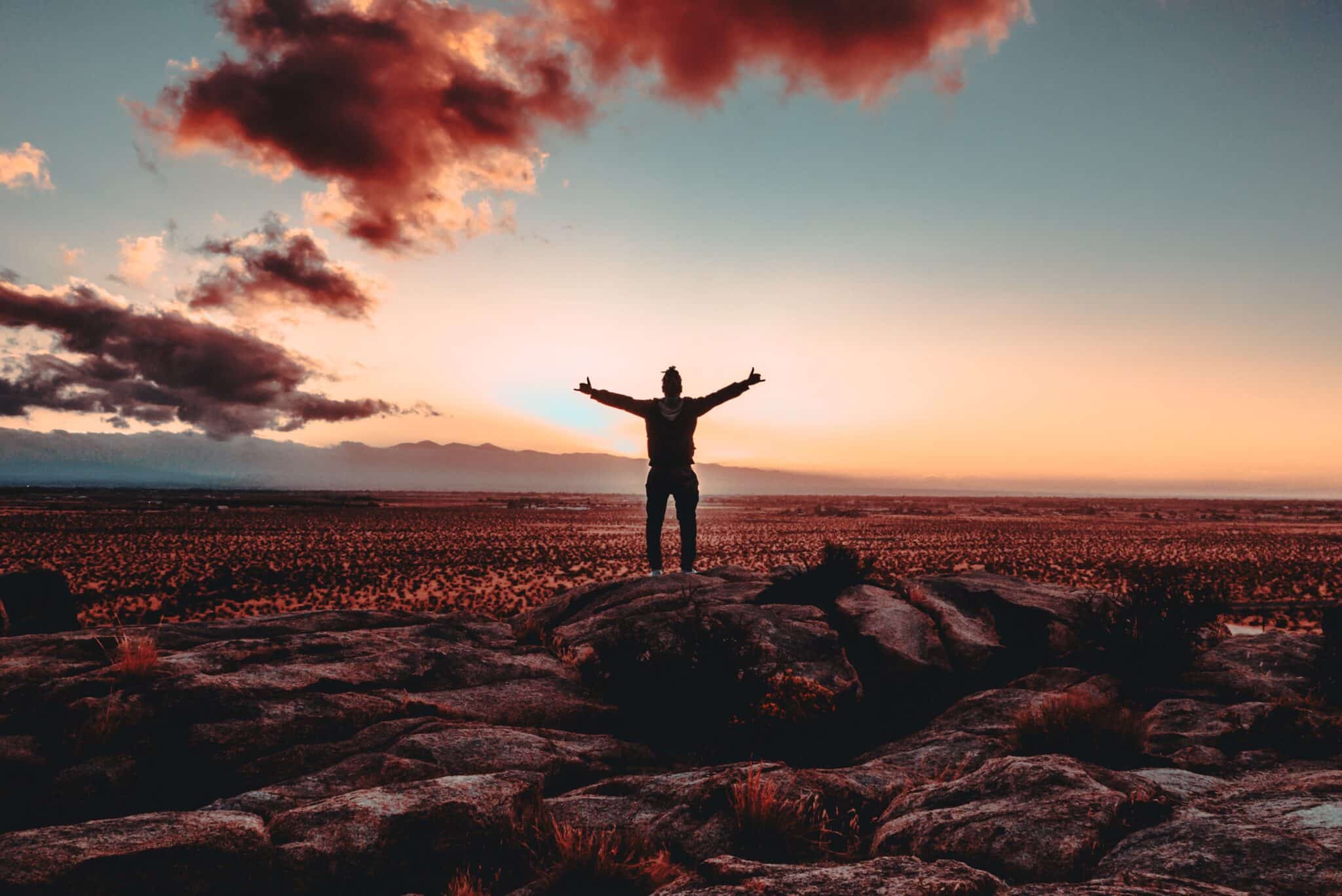 man with arms outstretched | Photo by Xan Griffin on Unsplash