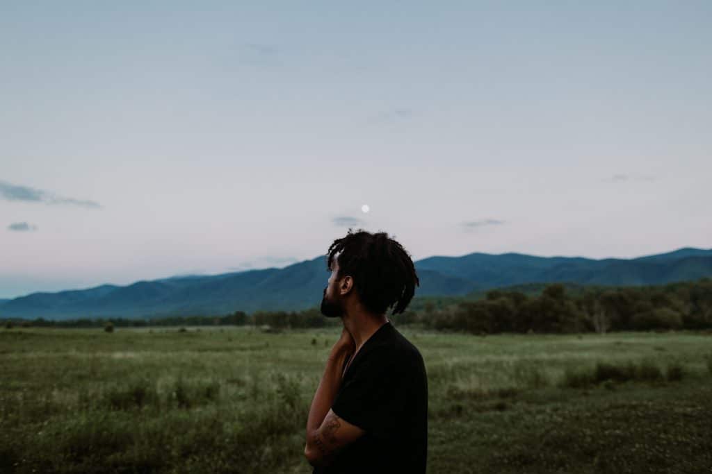 Man looking at the sky | Photo by Ivana Cajina on Unsplash
