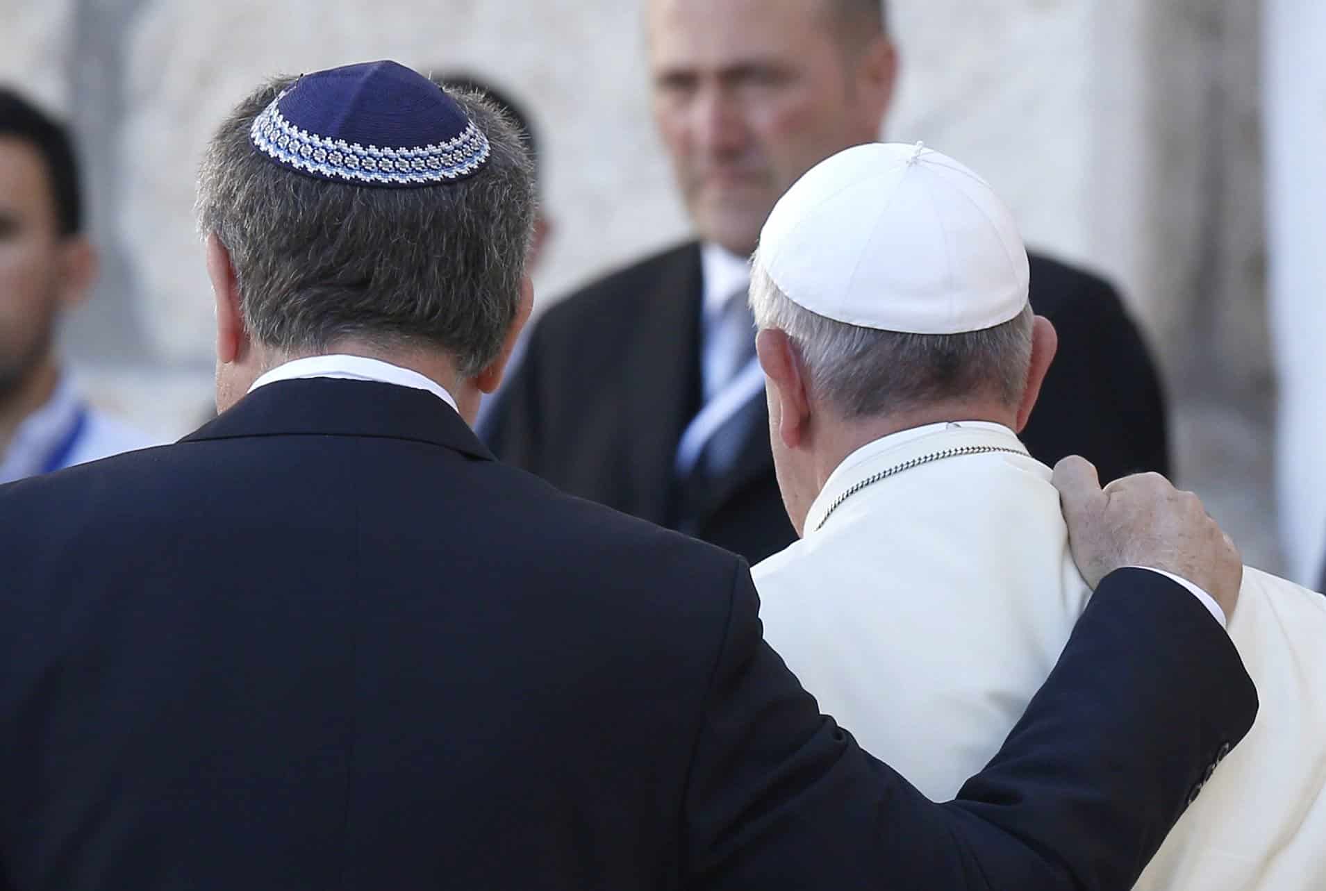 Rabbi Abraham Skorka of Buenos Aires, Argentina, and Pope Francis embrace after visiting the Western Wall in Jerusalem May 26, 2014. Rabbi Skorka, now a senior research fellow for Jewish studies and Jewish-Catholic relations at Georgetown University, and Washington Cardinal Wilton D. Gregory, sent a joint message to the Jewish community at Passover, which began on the evening of April 5, 2023, and will conclude on the evening of April 13 for Jews outside of Israel. (CNS photo/Paul Haring)