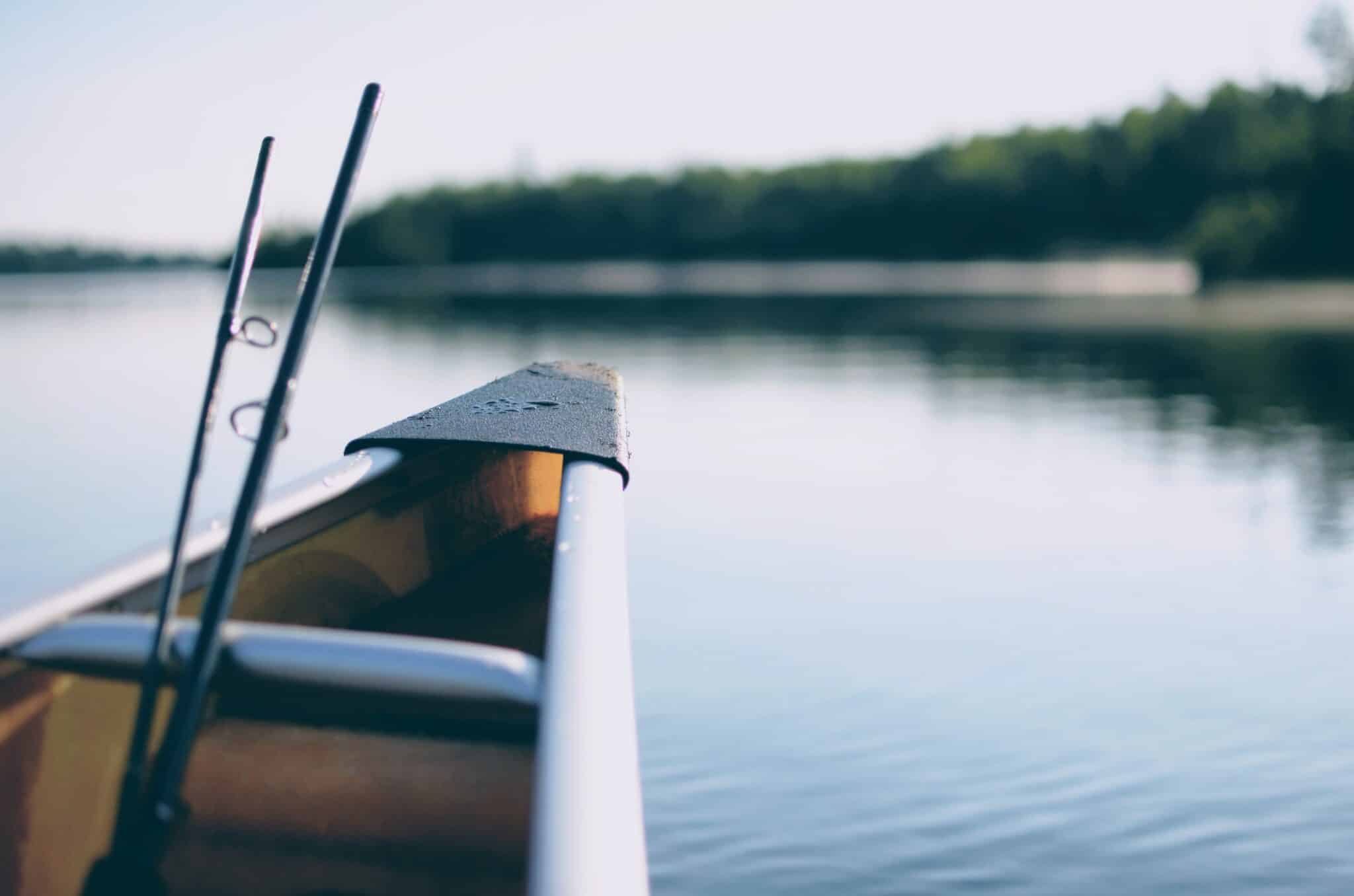 canoe on a lake | Photo by John Sekutowski on Unsplash