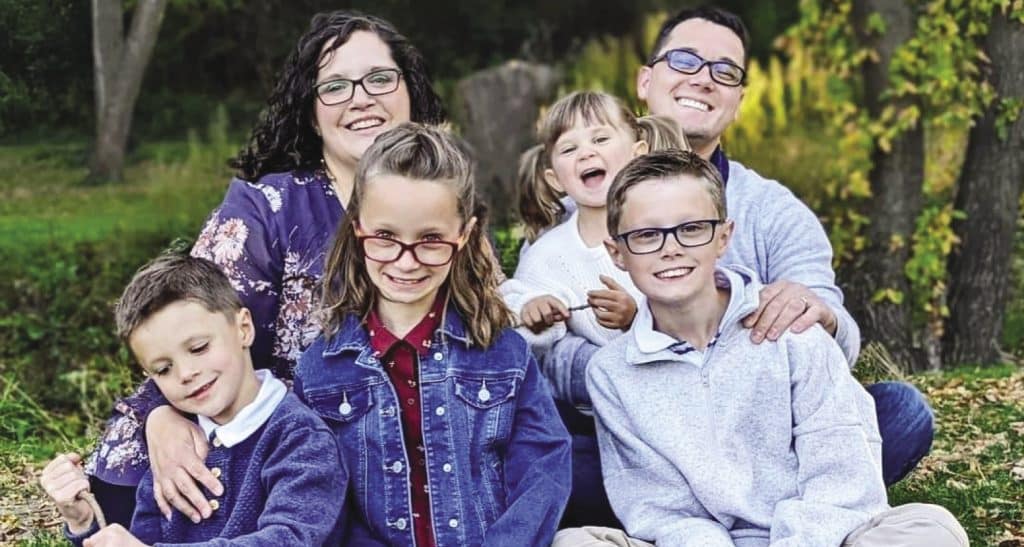 Matt Chicoine and his wife, Jennifer, are pictured with their four children
(from left to right): Josiah, Amelia, Avila, and Noah. Matt says the experience
of raising two children with autism is an example of how “God’s love is
patient and persistent.”