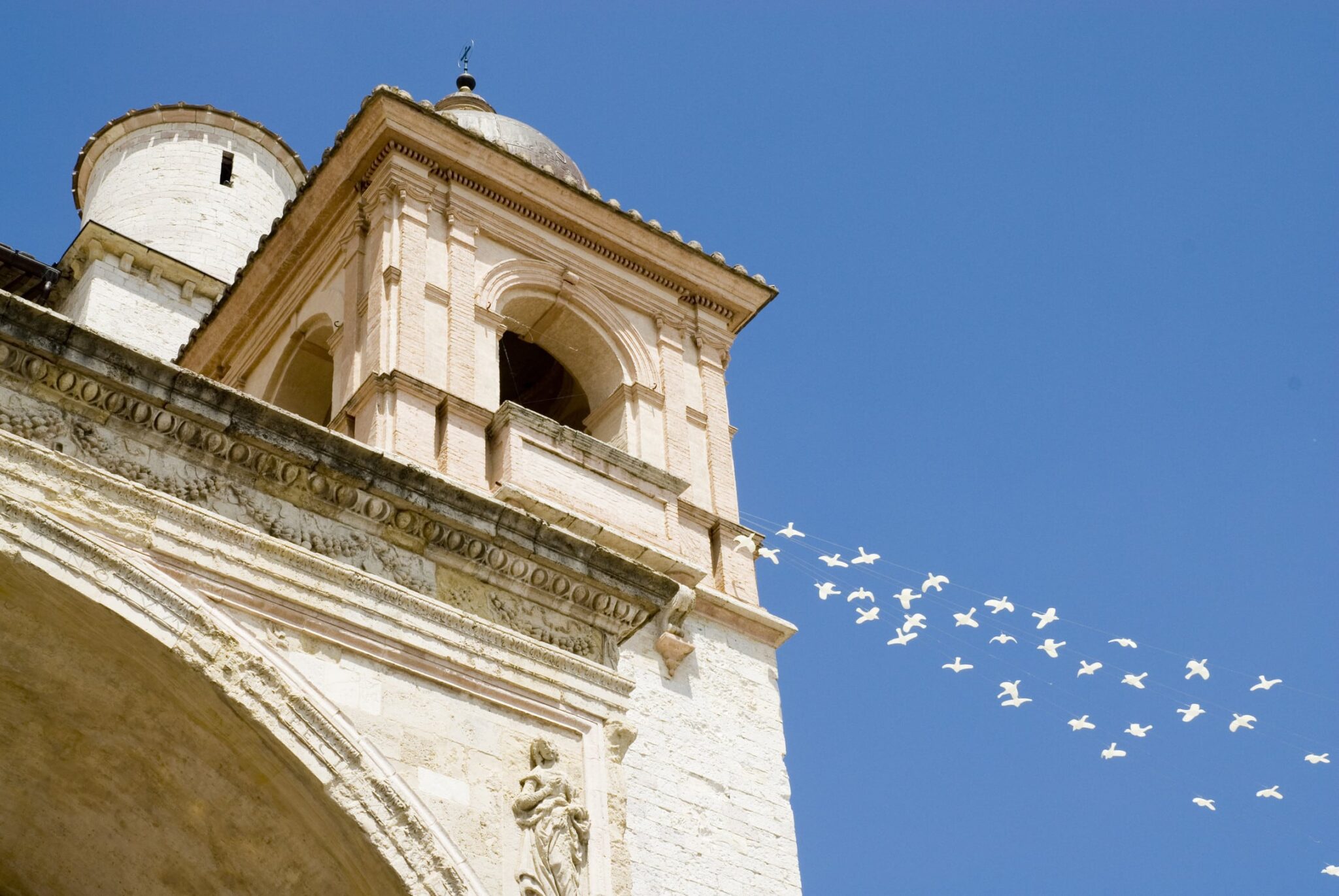 doves flying out of the basilica