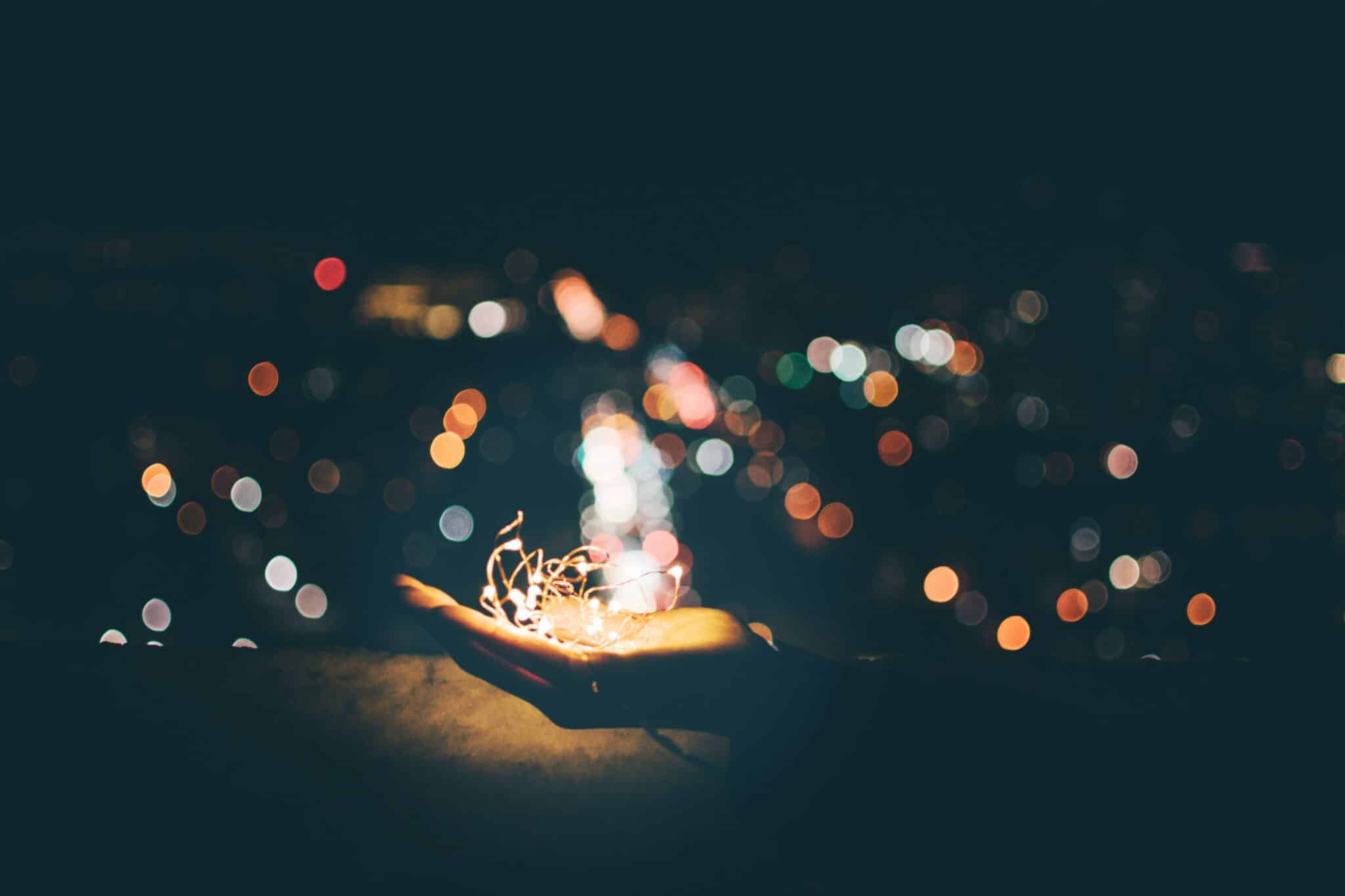 Holding stringed lights | Photo by Yeo Yonghwan on Unsplash