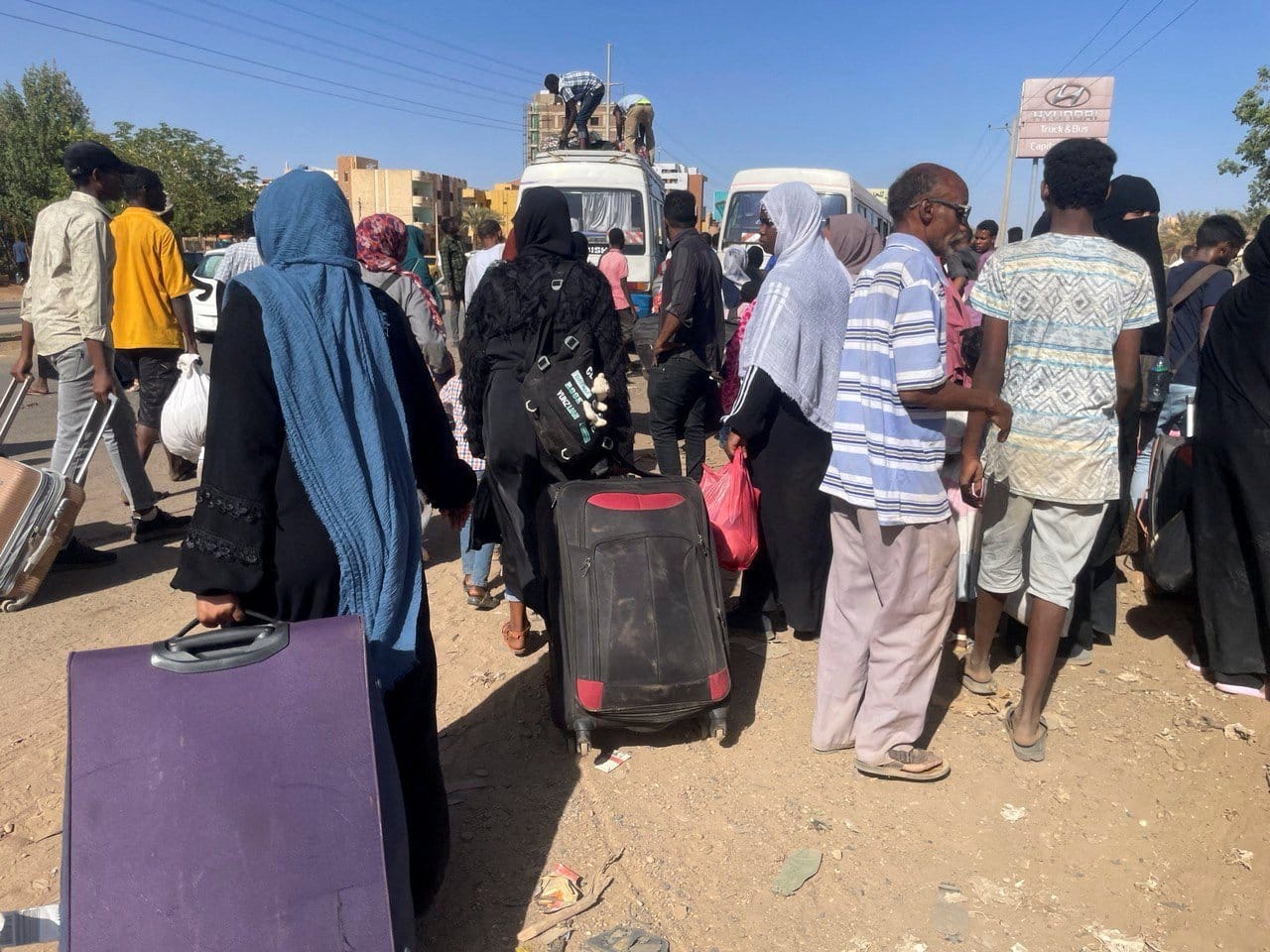 People fleeing clashes between the paramilitary Rapid Support Forces and the army gather at the bus station in Khartoum, Sudan, April 19, 2023. (OSV News photo/El-Tayeb Siddig, Reuters)