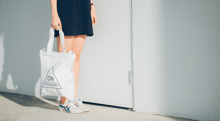 woman holding canvas bag