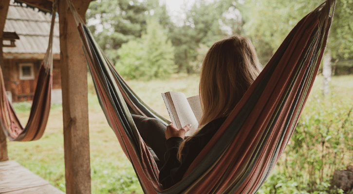 woman reading in a hammock