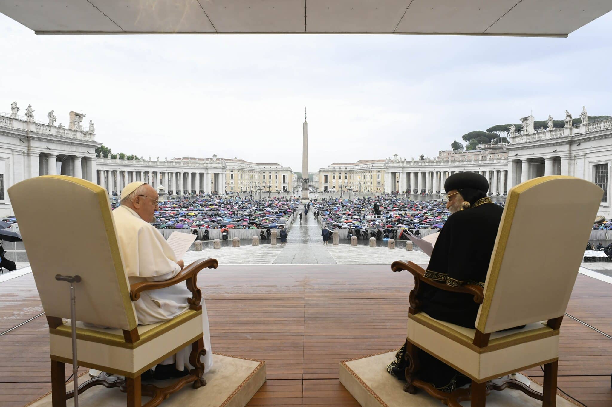 Pope Francis and Coptic Orthodox Pope Tawadros II publicly exchange greetings in St. Peter's Square at the Vatican May 10, 2023. Pope Tawadros was at the Vatican to commemorate the 50th anniversary of a joint declaration signed by the heads of the Catholic and Coptic Orthodox Churches. (CNS photo/Vatican Media)