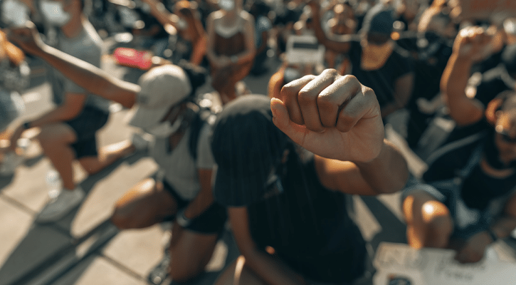 crowd of protesters with raised fists