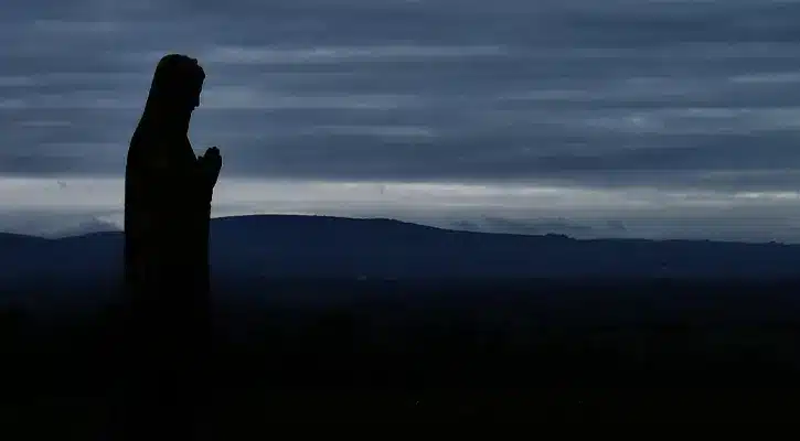silhouette of mary statue