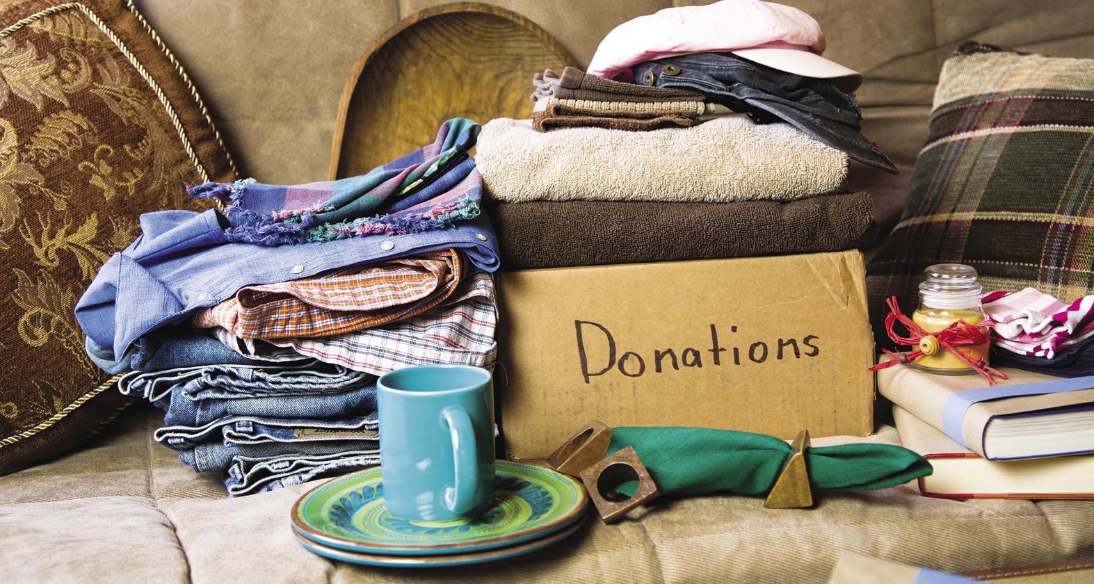 List of items to be donated sitting on a couch
