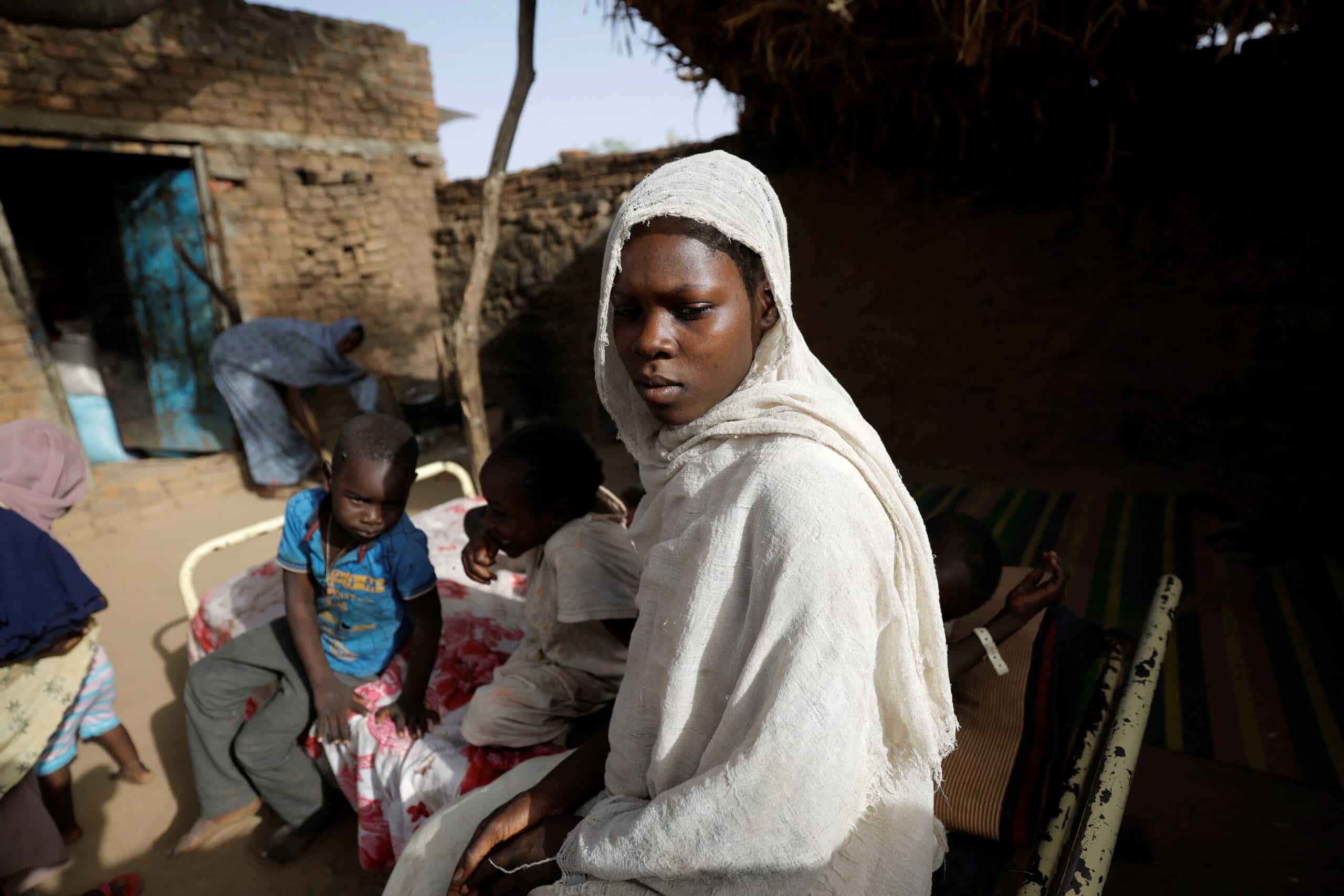 A young Sudanese woman who fled the violence in Sudan's Darfur region stands in the yard of a Chadian's family house May 14, 2023. She took refuge at the house in Koufroun, Chad, near the border between that country and Sudan. (OSV News photo/Zohra Bensemra, Reuters)