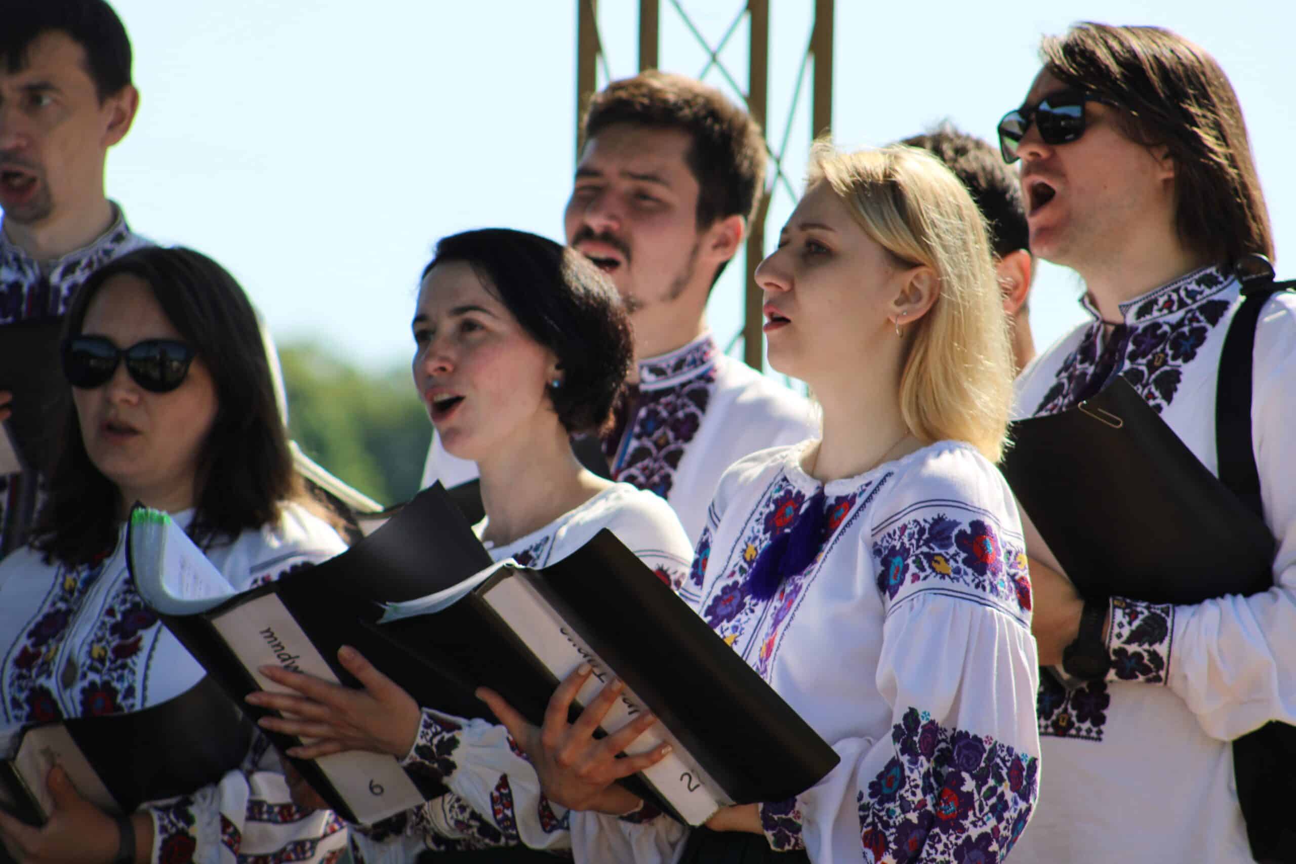 A Ukrainian Catholic choir dressed in traditional attire sings during a June 26, 2023, Divine Liturgy that drew thousands to Stradch, a Marian spiritual center in the Lviv region of Ukraine. (OSV News photo/Gina Christian)