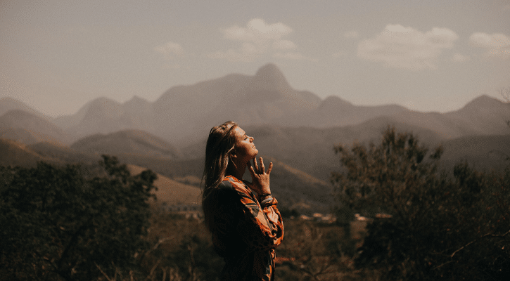 woman surrounded by mountains
