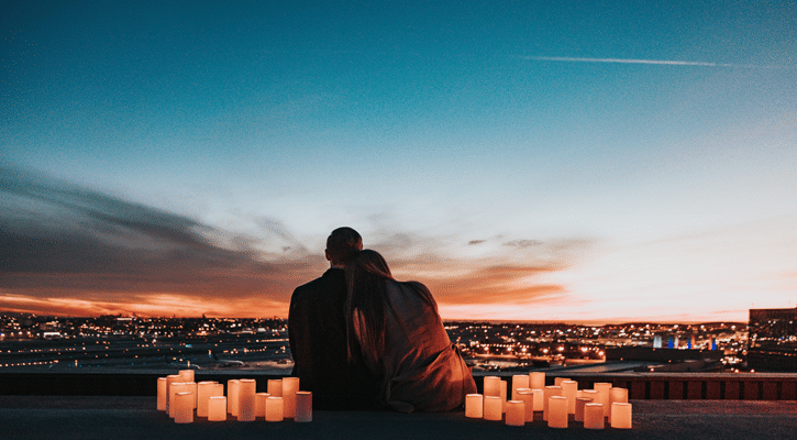 couple with candles and city view