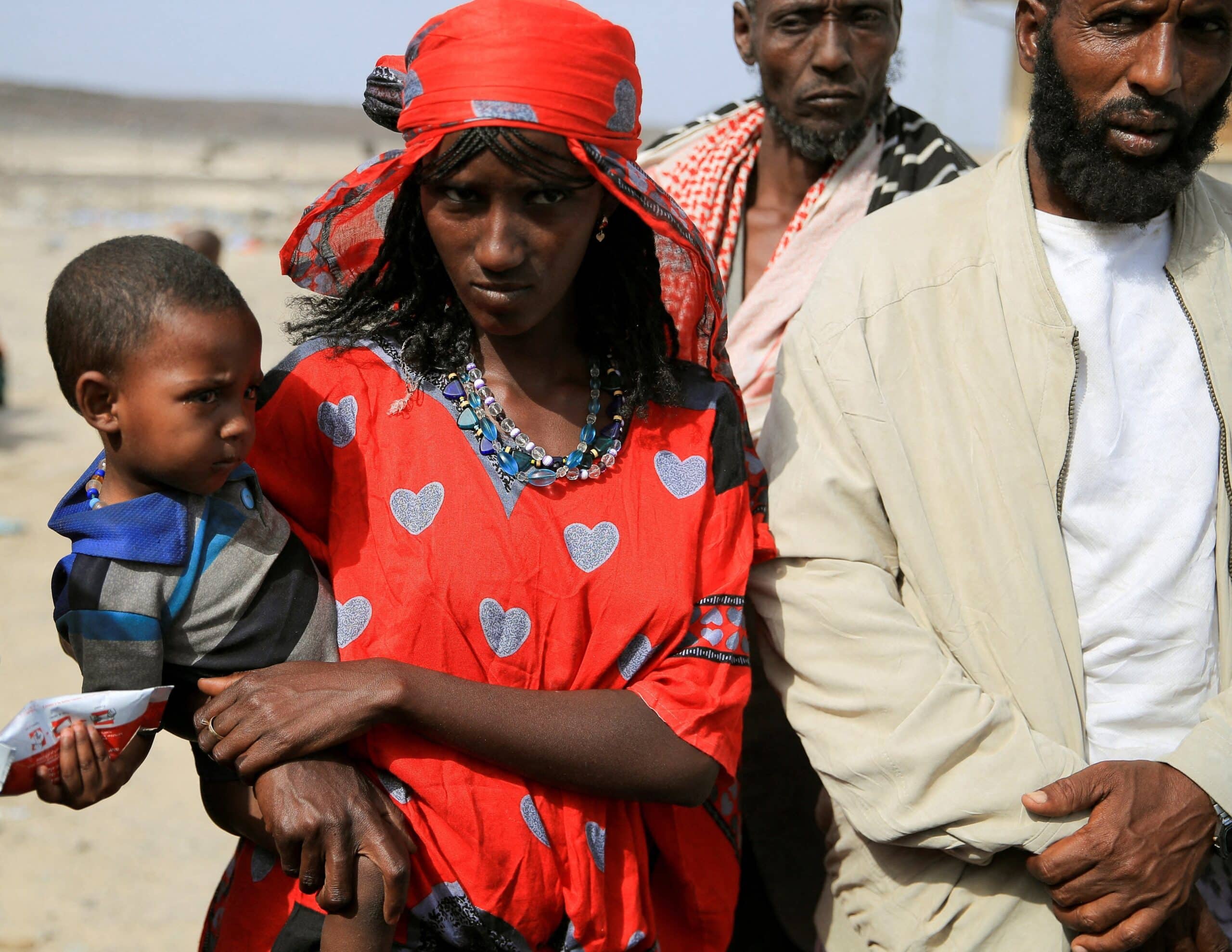 People who fled their homes due to fighting between the Afar Special Forces and the Tigray People's Liberation Front in Berhale, Ethiopia, wait for food near a makeshift compound in Afdera district, Feb. 23, 2022. (OSV News photo/Tiksa Negeri, Reuters)
