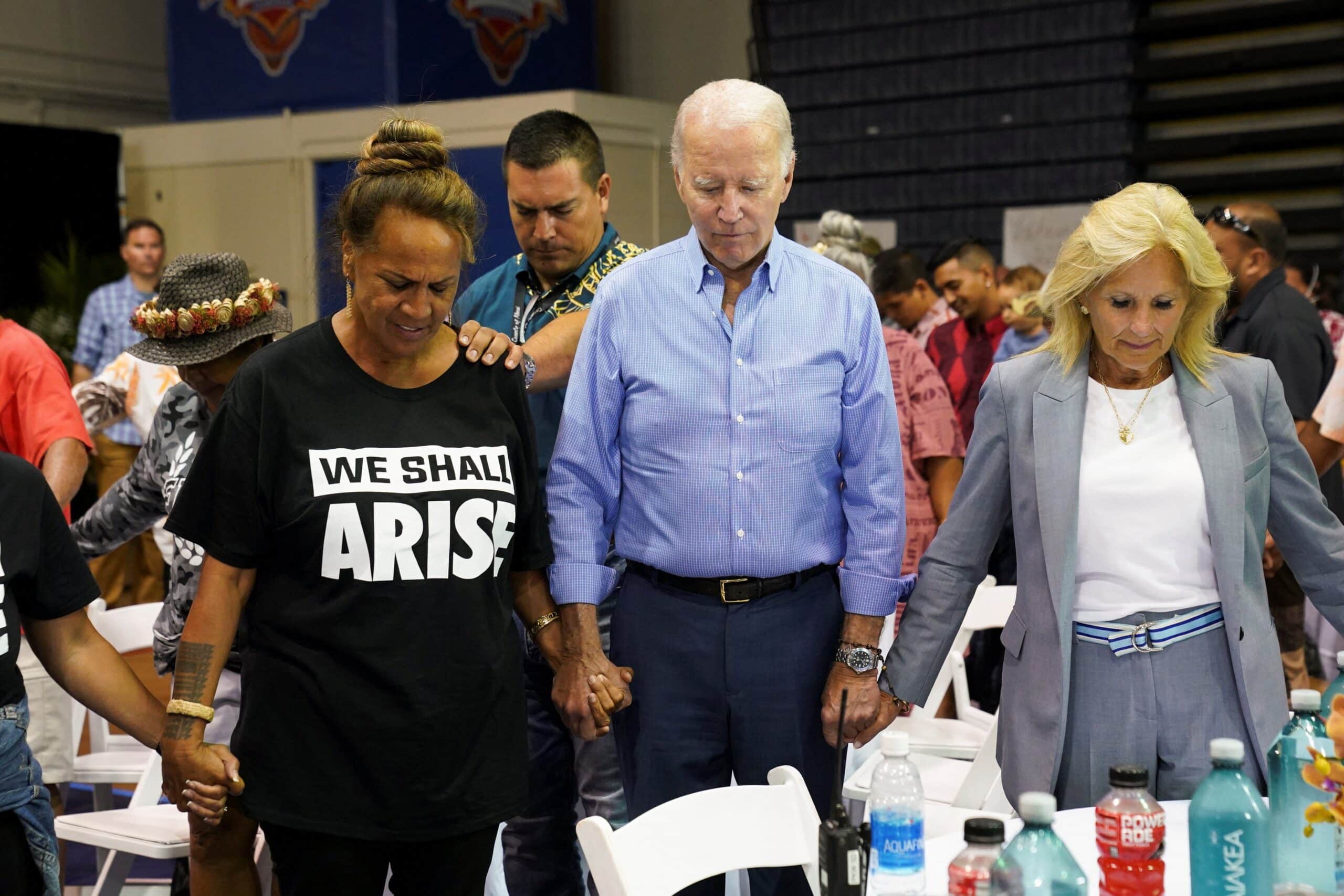 U.S. President Joe Biden and first lady Jill Biden praying with others