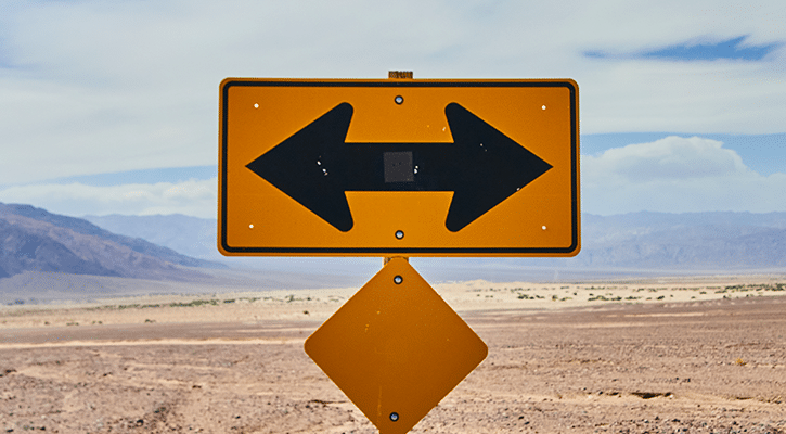 road sign with opposing arrows