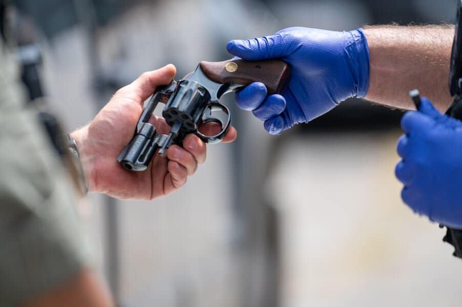 Baltimore City Police collected more than 300 guns during a gun buyback and resource event Aug. 5, 2023, at the Edmondson Village Shopping Center in West Baltimore. (OSV News Photo/Kevin J. Parks, Catholic Review)