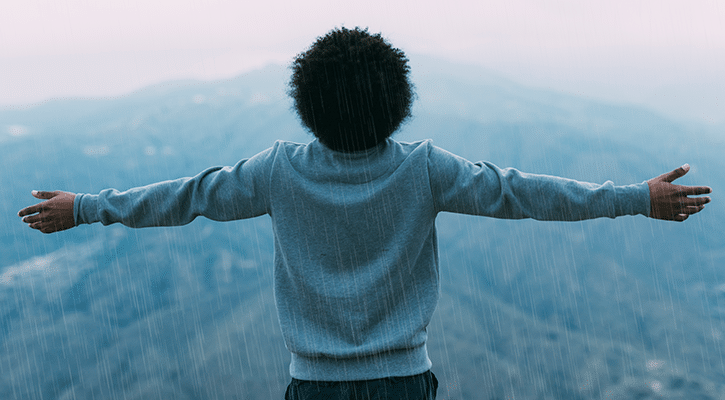 Man enjoying the moment of rain.