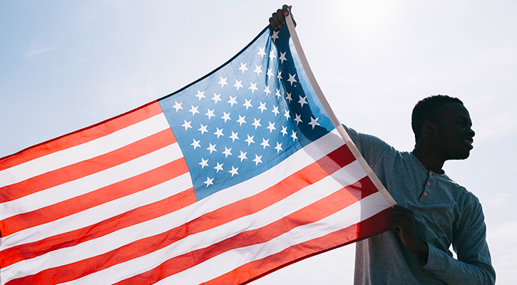 Man carrying American flag